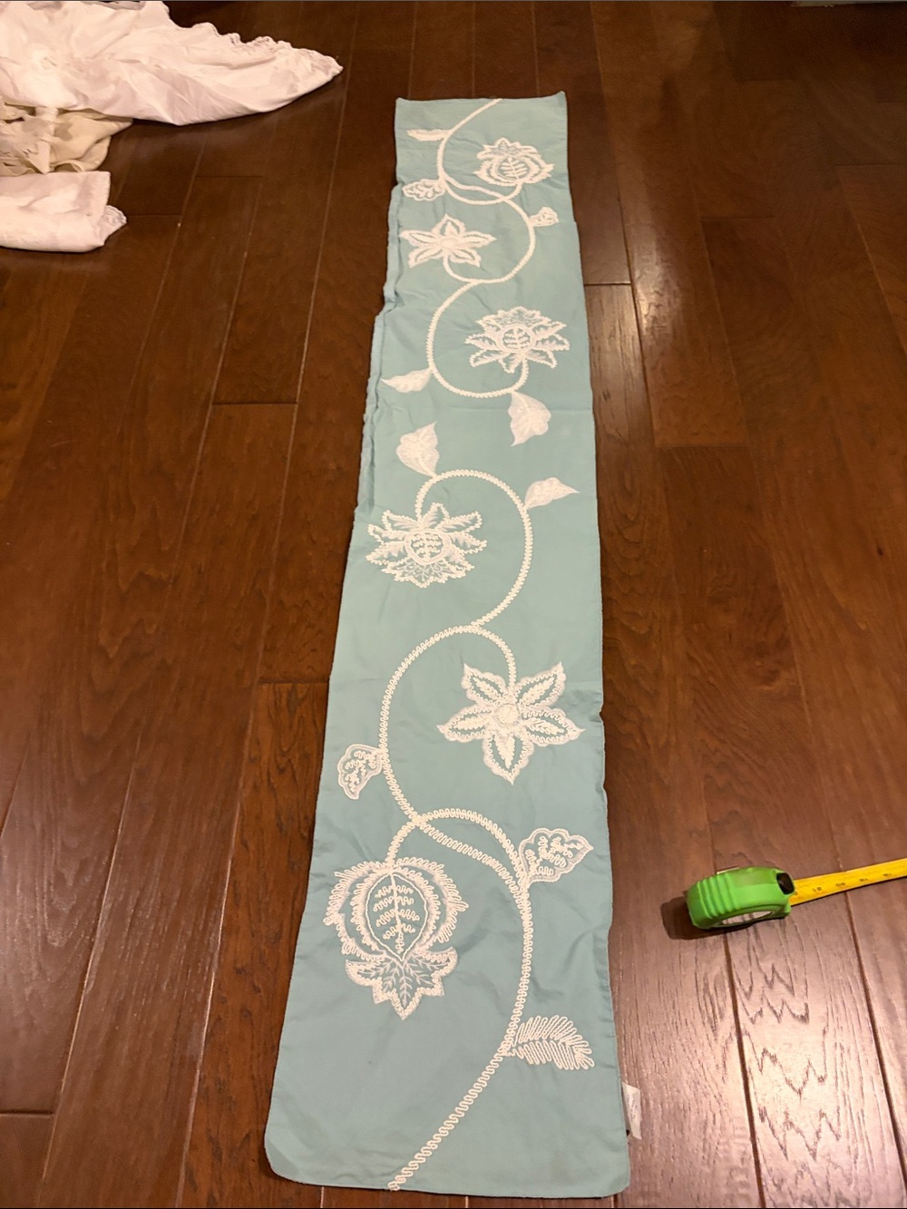 Beautiful Turquoise table runner with white embroidered flower scroll